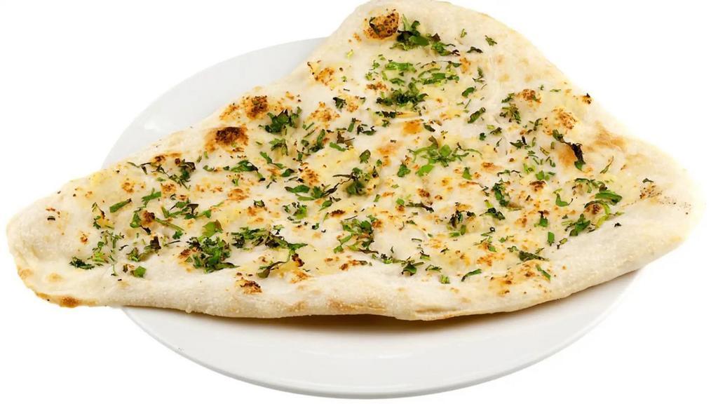 Garlic Naan · Soft leavened white bread with garlic and cilantro cooked in clay oven.
