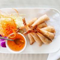 05. Royal Shrimp Rolls · Deep fried shrimp, wrapped in egg rolls skins, served with sweet and sour sauce.
