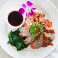 32. Roasted Duck Curry · Roasted duck topped with red curry.