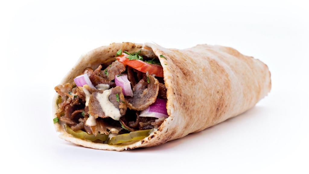Lamb and Beef Shawarma Wrap · Fresh wrap filled with hummus, tahini, tzatziki, red onion, hot sauce, lettuce, and sour red cabbage. Wrapped in customer's choice of bread.