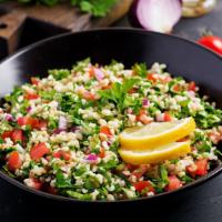 Tabbouleh (12z) · Parsley, green onions, tomatoes, olive oil, and lemon topped with crispy wheat pita chips.