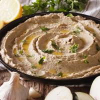 Baba Ghanoush · Smoky, roasted eggplant pureed with tahini and garlic and finished with a generous drizzle o...