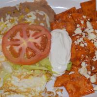 Chilaquiles Salsa Roja · choose salsa roja/red or salsa verde/green. Comes with beans, eggs, cheese and sour cream.