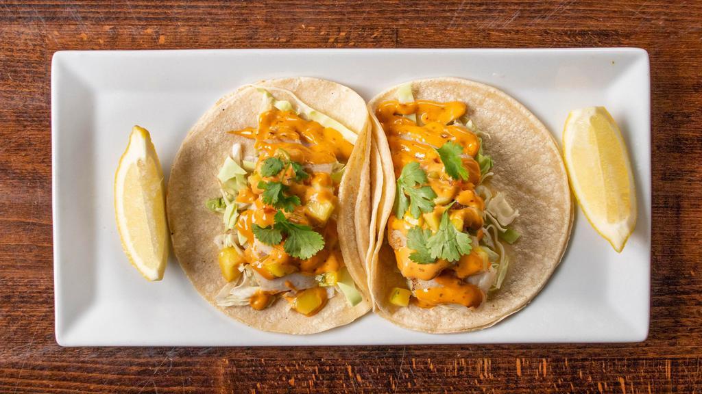 Street Style Fish Tacos · Gluten-free. Seasoned grilled cod & mild chipotle aioli in corn tortillas, topped with slaw and fresh mango pico de gallo.