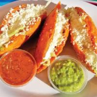Quesadillas Palacios · Fried quesadillas with your choice of potatoes with chorizo, chicken, or cheese. Served with...