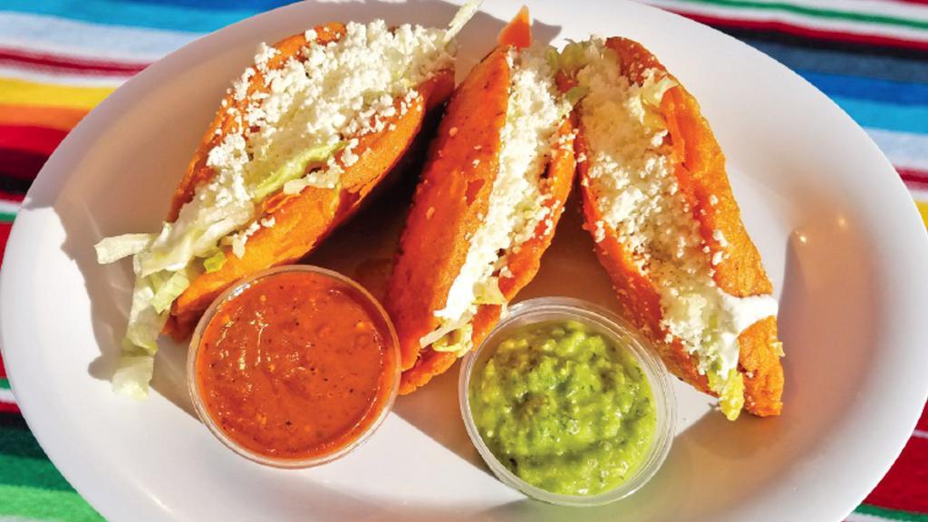 Quesadillas Palacios · Fried quesadillas with your choice of potatoes with chorizo, chicken, or cheese. Served with lettuce, cheese, sour cream, and salsa.