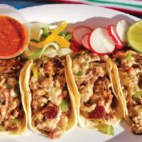 Alambres · Four tacos filled with a combination of bell pepper, onions, bacon, and your choice of meat.