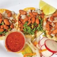 Tacos Palacios · Choice of meat, cilantro, onions, beans and salsa.