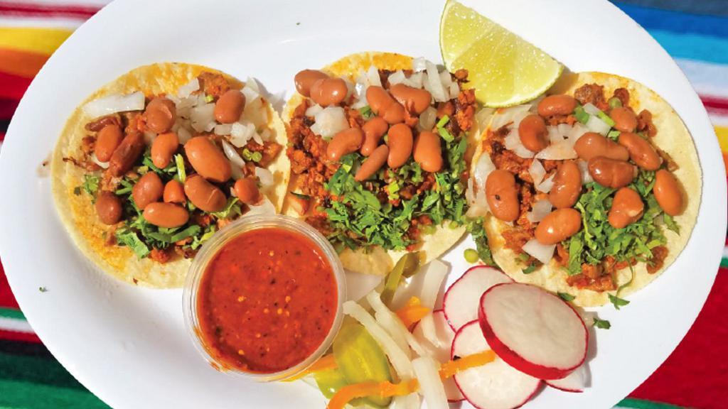 Tacos Palacios · Choice of meat, cilantro, onions, beans and salsa.