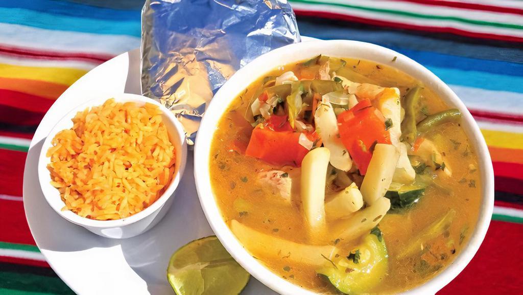 Caldo De Pollo · Chicken soup with vegetables. Comes with rice and handmade tortillas.