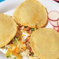 Mulitas · Three quesadillas sandwiches with handmade tortillas, cheese, and pico de gallo.