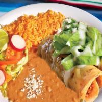 Plato De Flautas · Two fried crispy chicken tacos topped with sour cream and cheese. Served with rice, beans, a...