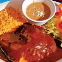 Pollo Con Mole · Chicken with Mexican mole. Served with rice, beans, salad, and tortillas.