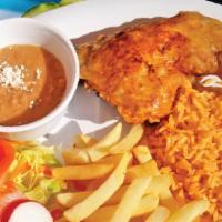 Pollo Dorado · Fried chicken served with rice, beans, french fries, and tortillas.