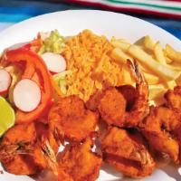 Camarones Empanisados · Breaded shrimp served with rice, French fries, and salad.