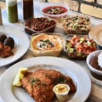 Orens Family Meal · Generously serves 3 - 4 . Choose any combination of skewers and schnitzel along with Hummus,...