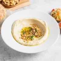 Hummus Jaffa Style · A unique, thicker style of hummus with more garlic, pine nuts, olive oil, and parsley (gf, v)