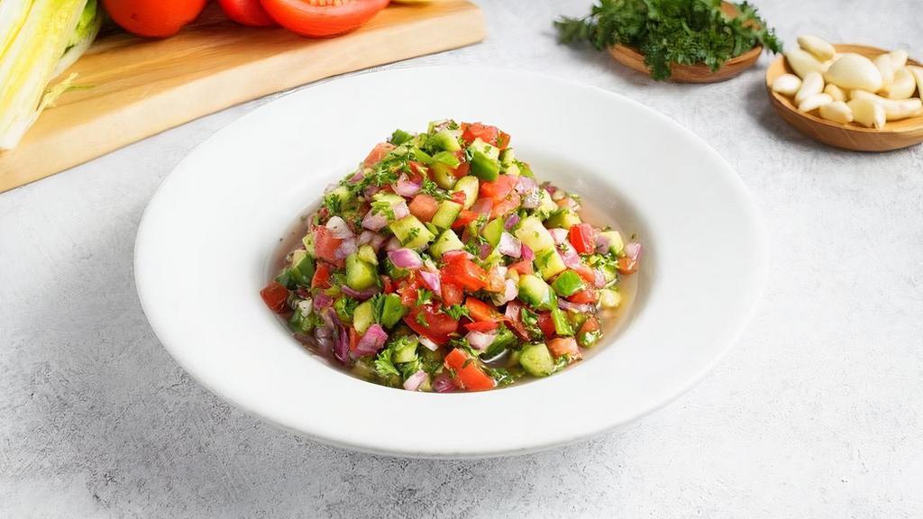 Large Israeli Salad · Chopped cucumber, tomato, red onion, and parsley, served with lemon vinaigrette . (gf, v)