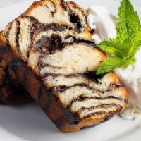 Chocolate Babka · (Two slices). Layers of chocolate and buttery brioche served warm then topped with whipped c...