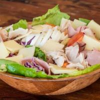 Chef Salad · Large salad with turkey, ham, Swiss cheese, and boiled egg.