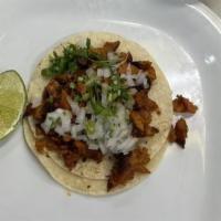 Tacos · Servidos con cebolla, cilanto y salsa. / Served with onion, coriander and sauce.