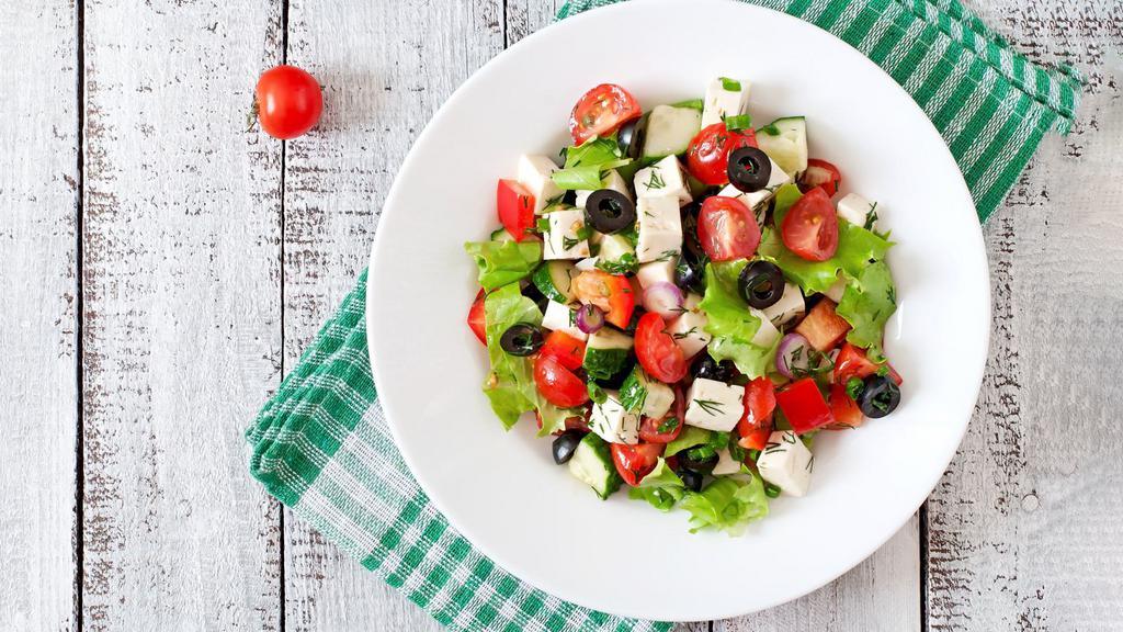 Greek Salad · Fresh romaine lettuce, feta cheese, cucumbers, tomatoes and olives.