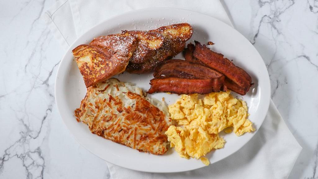Toast Combo (No Substitutions) · Two eggs any style, two pancakes or french toast and choice of bacon, bacon, chicken apple sausage, pork sausage or ham, served with hash browns.