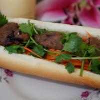 BBQ Pork · Marinated pork served on a French roll with mayonnaise, shredded carrots, cucumbers, cilantr...