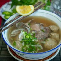6. Combination Beef Noodle Soup · Thinly sliced beef, meatball, & well-done flank. White rice noodles with thinly sliced beef,...