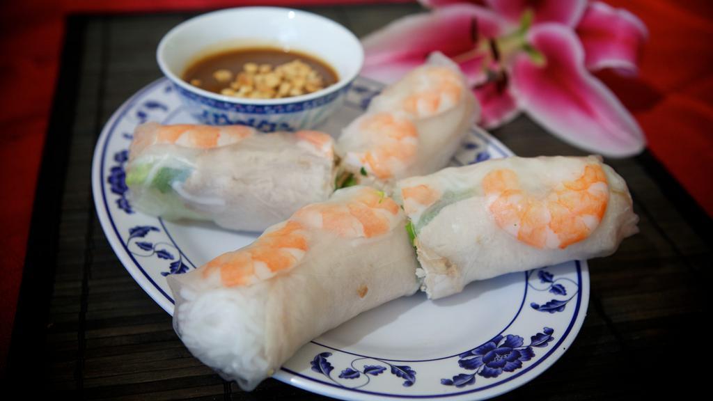 3. Shrimp & Pork Spring Rolls (2) · Dish includes peanuts. Steamed shrimp & pork wrapped in rice paper with vermicelli, lettuce, mint & bean sprouts, served with peanut sauce.