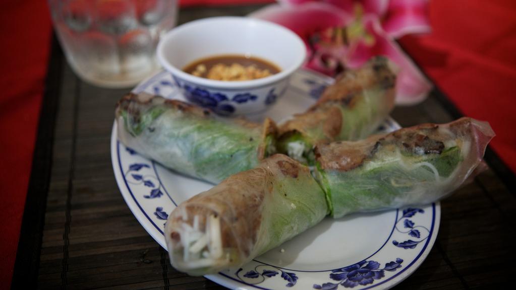 11. Grilled Pork & Shrimp Fresh Spring Rolls (2) · Dish includes peanuts. Grilled pork with steamed shrimp wrapped in rice paper with vermicelli, lettuce, chives mint & bean sprouts, and served with peanut sauce.