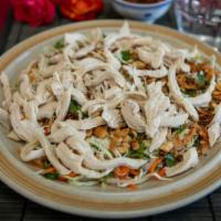 14. Chicken Vietnamese Salad · Dish includes peanuts. Shredded steam chicken breast over cabbage, carrots, herbs, vinaigret...