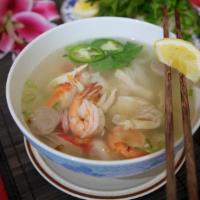 21. Combination Noodles (Seafood, Chicken & Meatballs) · White rice noodles, shrimp, calamari, crab claw, imitation crab, beef meatballs, shredded ch...