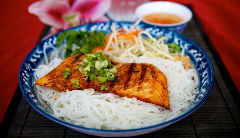 36. Grilled Salmon · Grilled salmon marinated with Le Paradis house sauce, served with white vermicelli noodles and vegetables. Topped with peanuts and onions.