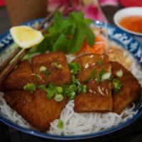 40. Lemongrass Fish · Fried tilapia fish seasoned with lemongrass served with white vermicelli noodles and vegetab...