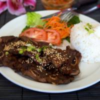 43. Korean BBQ Short Ribs (4) · Grilled Korean barbecue short ribs served with rice and vegetables.  Add tomato fried rice f...