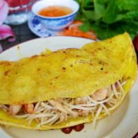 67b. Vietnamese Crepe · Crispy rice flour with bean sprouts, white onions, chicken, and shrimp, and served with lett...
