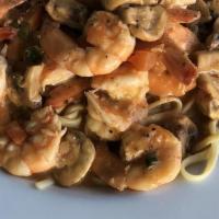 Shrimp Pesto Fettuccine · Fettucini pasta served in a light garlic pesto sauce with bay shrimps.