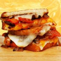 Fancy Grilled Cheese · Melted cheddar and pepperjack cheese with caramelized onions, tomato, and ripe avocado, betw...