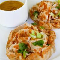Roti Paratha · Grilled Flatbread, green onions, curry dipping sauce.
