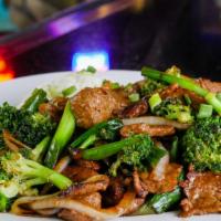 Beef & Broccoli · Thinly sliced beef, broccoli, onions, garlic, ginger, shoaxing wine, steamed jasmine rice.
