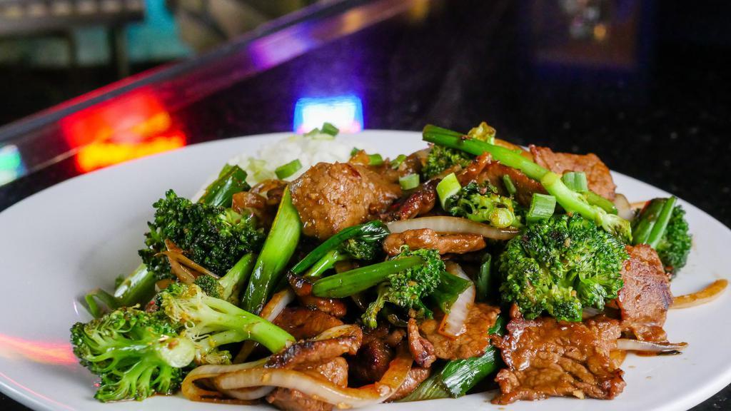 Beef & Broccoli · Thinly sliced beef, broccoli, onions, garlic, ginger, shoaxing wine, steamed jasmine rice.