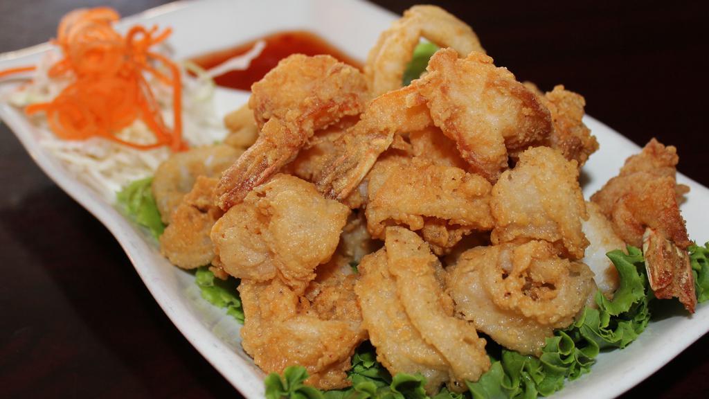 Koo Ruk (Fried Shrimp and Calamari) · Deep fried shrimp and calamari. Served with sweet and sour sauce.