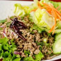 Larb · Spicy, gluten free. Choice of ground chicken or pork mixed with red onions, mint, cilantro, ...