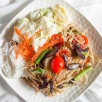 Som Tum Poo (Papaya Salad with Salted Crabs) · Spicy. Shredded green papaya salad with salted crab, tomatoes, green beans tossed in a chili...