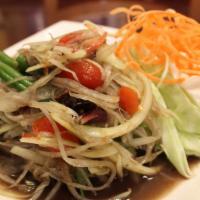 Som Tum Lao · Spicy, gluten free. Shredded green papaya salad with fermented crab paste, tomatoes, green b...
