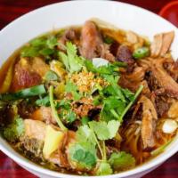 Pork Leg Stew Noodle Soup · Pork leg stew soup served with noodle, pickled mustard greens, and bean sprouts.