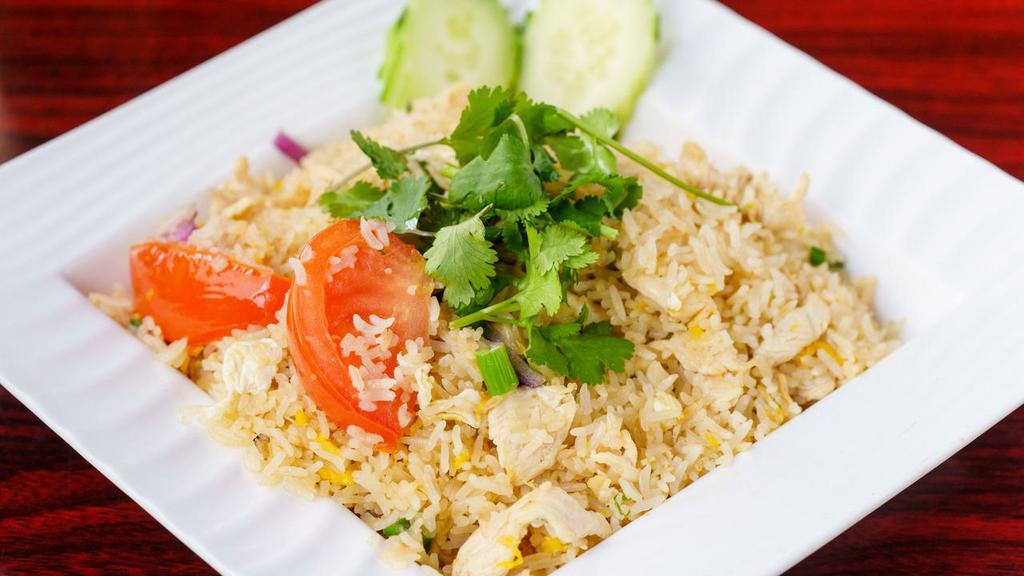 Kao Pad · Thai style fried rice with tomatoes, eggs and onions with choice of beef, chicken, or pork.