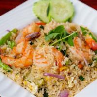 Basil Fried Rice · Thai style fried rice with eggs, onions, basil and your choice of meat.