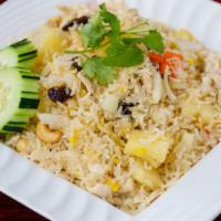 Vegetarian Pineapple Fried Rice · Fried rice with pineapple, eggs, raisin, cashew nuts, onions, and carrots.